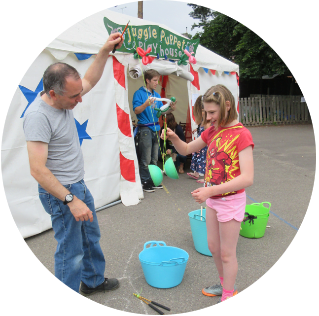 A child and parent playing at the summer party